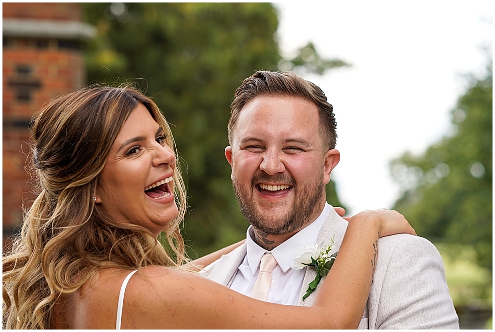 Real laughter with a bride and groom at The Elvetham Hotel, Hampshire