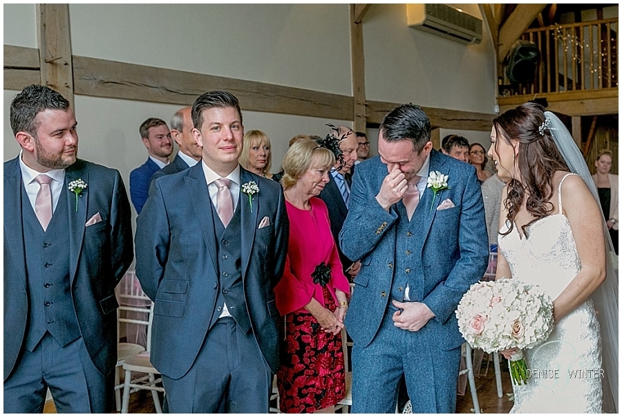An emotional groom greets his bride on their wedding day at Cain Manor