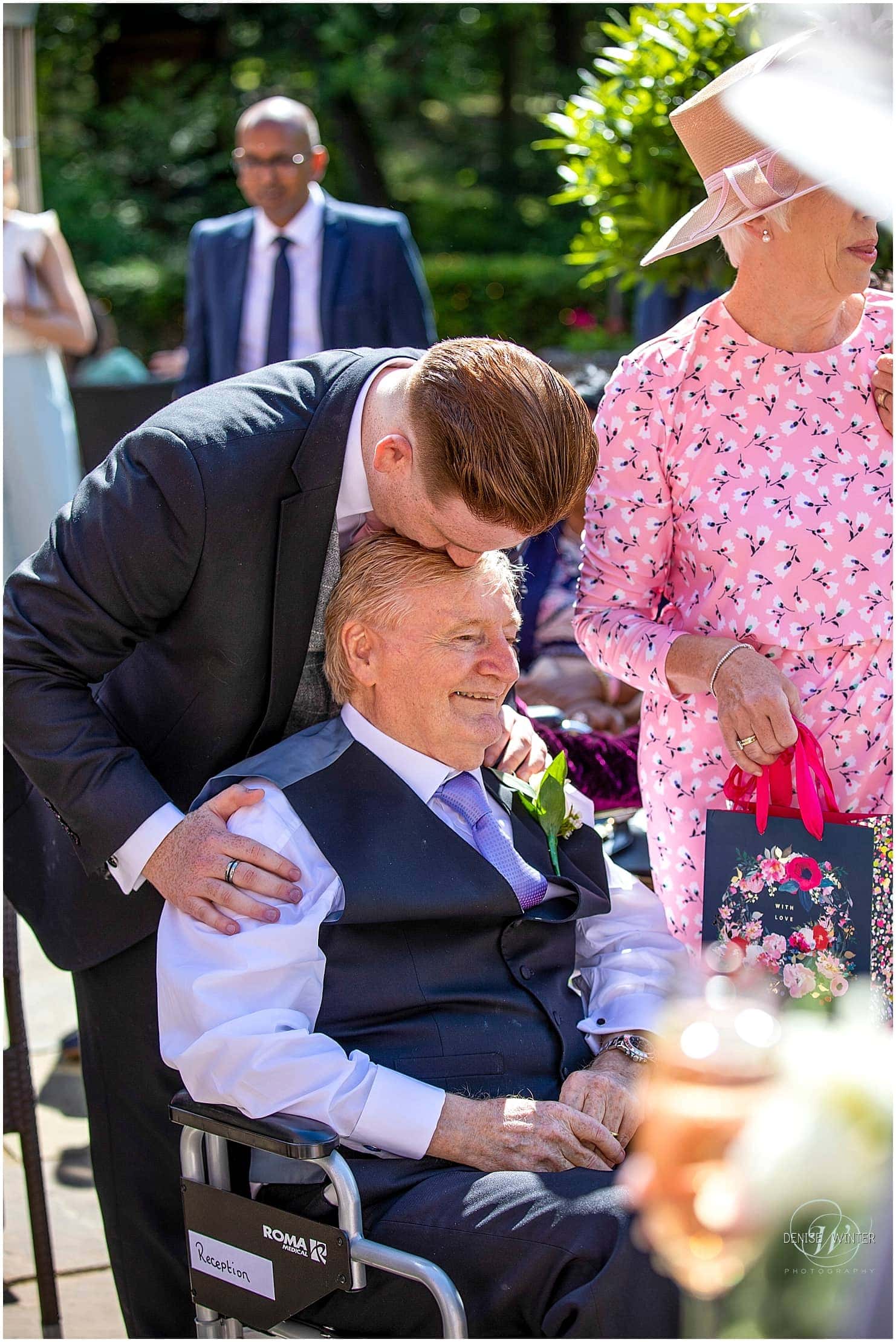Father and son moment at a wedding at the Four Seasons hotel in Hampshire