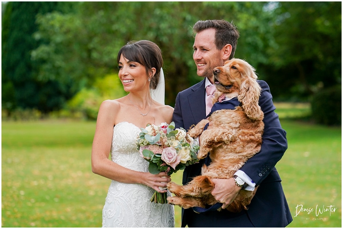 Summer wedding at royal Berkshire Hotel, bride and groom with their dog